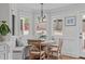 Bright breakfast nook with bench seating and backyard views at 1107 Daleland Dr, Raleigh, NC 27612