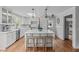Bright and airy kitchen with island, wooden floors, and modern appliances at 1107 Daleland Dr, Raleigh, NC 27612