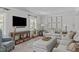 Cozy living room with comfortable seating, decorative maps, and hardwood floors at 1107 Daleland Dr, Raleigh, NC 27612