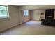 Large basement area features a fireplace and windows for ample lighting at 113 Colonial Dr, Wendell, NC 27591