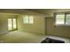 Unfinished basement features an egress door and multiple windows for natural light at 113 Colonial Dr, Wendell, NC 27591