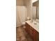 Bathroom featuring a toilet, shower with curtain, and vanity with double sinks at 113 Colonial Dr, Wendell, NC 27591