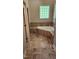 Bright bathroom featuring a soaking tub, decorative tile, and a window allowing natural light at 113 Colonial Dr, Wendell, NC 27591