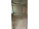 A spacious carpeted bedroom with neutral walls, tray ceiling, and a ceiling fan at 113 Colonial Dr, Wendell, NC 27591