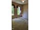 This bedroom features two windows with maroon accents, carpeted floors, and neutral walls at 113 Colonial Dr, Wendell, NC 27591