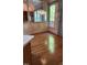 Breakfast nook featuring hardwood floors, large windows with natural light, and wooden cabinets at 113 Colonial Dr, Wendell, NC 27591
