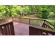 Backyard deck surrounded by lush greenery offers a peaceful retreat at 113 Colonial Dr, Wendell, NC 27591