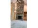 Living room featuring a stone fireplace, built-in shelves, and vaulted ceilings at 113 Colonial Dr, Wendell, NC 27591