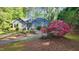 Beautiful home with lush landscaping, blooming azaleas, and a welcoming entrance at 113 Colonial Dr, Wendell, NC 27591