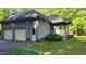 View of the home's attached garage and screened in porch at 113 Colonial Dr, Wendell, NC 27591