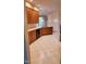 Kitchen featuring wooden cabinets, a sink, and a black dishwasher with patterned flooring at 113 Colonial Dr, Wendell, NC 27591