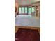 Open living space with hardwood floors, built-in cabinets, and a view of the backyard at 113 Colonial Dr, Wendell, NC 27591