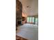 Bright living room with a stone fireplace, built-in cabinets, and backyard views at 113 Colonial Dr, Wendell, NC 27591