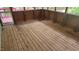 Spacious screened porch featuring a wood floor and an abundance of light at 113 Colonial Dr, Wendell, NC 27591