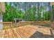 Spacious wood deck for outdoor entertaining with a natural wooded backyard view at 123 Alan Ln, Clayton, NC 27520