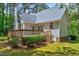 Rear exterior view of home featuring wood deck and gray siding at 123 Alan Ln, Clayton, NC 27520