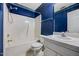 Bathroom featuring blue walls, a single sink vanity, and a shower/tub combo at 123 Alan Ln, Clayton, NC 27520