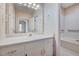 Charming bathroom with vintage floral wallpaper, single sink vanity, and tub/shower combo at 123 Alan Ln, Clayton, NC 27520