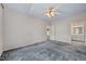 Bedroom featuring vaulted ceilings, neutral carpeting, and ensuite bathroom at 123 Alan Ln, Clayton, NC 27520