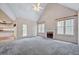 Cozy living room with a fireplace, vaulted ceiling, and access to the kitchen at 123 Alan Ln, Clayton, NC 27520