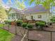 Lush green backyard showing a back porch, back deck, and an enclosed yard space at 1245 Torchlight Way, Raleigh, NC 27603
