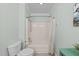 Bathroom featuring a tub-shower combination and white fixtures at 1245 Torchlight Way, Raleigh, NC 27603