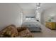 Comfortable bedroom with a ceiling fan, large chair, and desk area at 1245 Torchlight Way, Raleigh, NC 27603