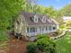 An elevated view of a lovely home with a cozy front porch and manicured landscape at 1245 Torchlight Way, Raleigh, NC 27603