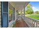 Inviting porch with rocking chairs and lovely views to enjoy your morning coffee at 1245 Torchlight Way, Raleigh, NC 27603