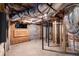 Exposed basement with visible HVAC system, utilities, and support beams, offering a glimpse into the home's infrastructure at 130 N Bloodworth St, Raleigh, NC 27601