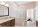 Bathroom with walk-in shower, a sink, and freestanding tub at 130 N Bloodworth St, Raleigh, NC 27601