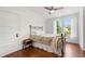 Sunlit bedroom with hardwood floors, a ceiling fan and a bed frame at 130 N Bloodworth St, Raleigh, NC 27601