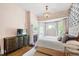 Bedroom with a fireplace and a chandelier, offering a cozy and elegant space at 130 N Bloodworth St, Raleigh, NC 27601