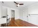 Bedroom with hardwood floors, a ceiling fan, and a desk at 130 N Bloodworth St, Raleigh, NC 27601