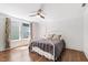 Bedroom with a ceiling fan and a bed near two windows at 130 N Bloodworth St, Raleigh, NC 27601