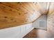 A cozy wood-paneled closet showcases a window and built-in bench for added functionality and comfort at 130 N Bloodworth St, Raleigh, NC 27601