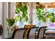 Dining room area is brightened with natural light and features a vibrant floral arrangement at 130 N Bloodworth St, Raleigh, NC 27601