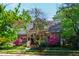 Charming home with a landscaped front yard, covered porch, and flowering trees at 130 N Bloodworth St, Raleigh, NC 27601