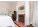 A charming fireplace adds warmth to the bedroom and complementing its elegant design at 130 N Bloodworth St, Raleigh, NC 27601