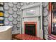 Close-up of a charming fireplace with white mantel and brick hearth, showcasing classic design at 130 N Bloodworth St, Raleigh, NC 27601