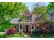 Charming home exterior with lush landscaping, a cozy porch, and a welcoming entrance at 130 N Bloodworth St, Raleigh, NC 27601