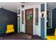 Inviting front porch with a wooden door, detailed sidelights, and stylish outdoor lighting at 130 N Bloodworth St, Raleigh, NC 27601