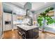 Bright kitchen with a large island, stainless steel appliances, and ample cabinet space at 130 N Bloodworth St, Raleigh, NC 27601