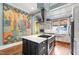 Well-appointed kitchen with stainless steel appliances, large island, and abundant natural light at 130 N Bloodworth St, Raleigh, NC 27601