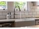Close-up of a kitchen sink with modern faucet and white subway tile backsplash at 130 N Bloodworth St, Raleigh, NC 27601