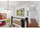 Upstairs landing with artwork and hardwood floors, offering a bright and airy feel at 130 N Bloodworth St, Raleigh, NC 27601