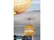 A close up of a unique woven light fixture throwing an elaborate shadow on the ceiling at 130 N Bloodworth St, Raleigh, NC 27601