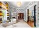 Spacious living room featuring a fireplace, chandelier, and seamless transition to other areas at 130 N Bloodworth St, Raleigh, NC 27601