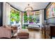 Bright living room featuring stylish furniture, hardwood floors, and large windows offering scenic outdoor views at 130 N Bloodworth St, Raleigh, NC 27601