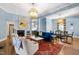Bright living room boasts hardwood floors, a decorative fireplace, and comfortable seating at 130 N Bloodworth St, Raleigh, NC 27601